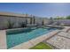 Sparkling backyard pool featuring desert landscaping, lounge chairs, and tanning ledge at 19323 E Canary Way, Queen Creek, AZ 85142