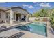 Lounge by the pool in the backyard oasis, featuring a covered patio with seating at 19323 E Canary Way, Queen Creek, AZ 85142