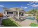 Relaxing backyard area featuring a pool, chairs, and patio seating at 19323 E Canary Way, Queen Creek, AZ 85142
