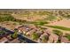 Aerial of the neighborhood, adjacent golf course and community amenities at 21533 N Greenway Rd, Maricopa, AZ 85138