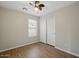 Bedroom with a closet, window, and wood-look flooring at 21533 N Greenway Rd, Maricopa, AZ 85138