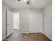 Bedroom with a closet and wood-look flooring at 21533 N Greenway Rd, Maricopa, AZ 85138