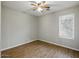 Bedroom with a window and wood-look flooring at 21533 N Greenway Rd, Maricopa, AZ 85138