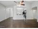 Open living room featuring wood-look tile flooring and a ceiling fan at 21533 N Greenway Rd, Maricopa, AZ 85138