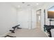 Neutral bedroom showcasing a double sliding door closet and an entertainment center at 22023 N 28Th Pl, Phoenix, AZ 85050