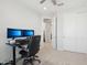 Neutral bedroom showcasing a double sliding door closet and an office desk at 22023 N 28Th Pl, Phoenix, AZ 85050