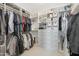 Well-organized walk-in closet with custom shelving and ample hanging space for clothes and accessories at 22023 N 28Th Pl, Phoenix, AZ 85050