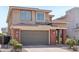 Beautiful two-story home with a gray garage door, brick pillars, and manicured front yard at 22023 N 28Th Pl, Phoenix, AZ 85050