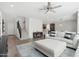 Bright living room with wood flooring, white walls, and an open staircase, great for gatherings at 22023 N 28Th Pl, Phoenix, AZ 85050