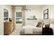 Inviting bedroom with natural light, stylish furniture, and comfortable bed at 23207 W Marguerite Ave, Buckeye, AZ 85326
