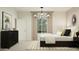 Beautifully staged bedroom with neutral tones, ample natural light, and stylish furnishings at 23207 W Marguerite Ave, Buckeye, AZ 85326