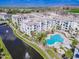 An aerial view showcasing the community's pool, water features, and white building exteriors at 2511 W Queen Creek Rd # 374, Chandler, AZ 85248