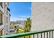 Enjoy the view from this balcony overlooking a neighborhood, palm trees, and clear blue skies at 2511 W Queen Creek Rd # 374, Chandler, AZ 85248