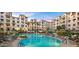 Resort-style community pool and seating with umbrellas, perfect for relaxation and leisure at 2511 W Queen Creek Rd # 374, Chandler, AZ 85248