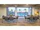 A dining area with tables and chairs, showcasing views of the community pool outside at 2511 W Queen Creek Rd # 374, Chandler, AZ 85248