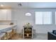 Eat-in kitchen dining area features quartz counters, pendant lighting, and seating for four at 2511 W Queen Creek Rd # 374, Chandler, AZ 85248