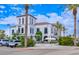 A picturesque view of the Vault restaurant in DC Ranch, featuring an outdoor patio with shade and palm trees at 2511 W Queen Creek Rd # 374, Chandler, AZ 85248