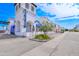 An attractive view of a white restaurant exterior with archways, landscaping, and convenient street access at 2511 W Queen Creek Rd # 374, Chandler, AZ 85248