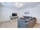 Bright living room with large windows, ceiling fan and a comfortable sectional sofa at 2511 W Queen Creek Rd # 374, Chandler, AZ 85248