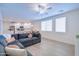 Bright, open-concept living space features a modern kitchen and a comfortable gray sectional sofa at 2511 W Queen Creek Rd # 374, Chandler, AZ 85248