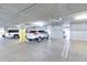 Inside a well-lit parking garage with painted parking space numbers at 2511 W Queen Creek Rd # 374, Chandler, AZ 85248
