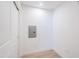 Small room with an electrical panel, white walls, and light hardwood floors near white doors at 2511 W Queen Creek Rd # 374, Chandler, AZ 85248