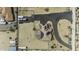 The aerial view captures the desert property with solar panels and circular driveway at 2751 N Ralston Rd, Maricopa, AZ 85139