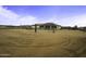 Expansive backyard offers plenty of space for outdoor activities and features desert landscaping at 2751 N Ralston Rd, Maricopa, AZ 85139