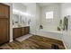 Bathroom features wood floors, dual sinks, and soaking tub at 2751 N Ralston Rd, Maricopa, AZ 85139
