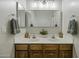 Bathroom highlighting double sink vanity with wood cabinets and modern fixtures at 2751 N Ralston Rd, Maricopa, AZ 85139
