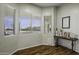 This inviting den offers natural light, wood floors, and a space for both relaxation and reflection at 2751 N Ralston Rd, Maricopa, AZ 85139