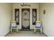 Cozy front porch featuring two rocking chairs, decorative metalwork, and a welcoming entrance at 2751 N Ralston Rd, Maricopa, AZ 85139