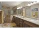 Bathroom featuring a double sink vanity, granite countertops, and tile flooring at 2917 E Northridge St, Mesa, AZ 85213