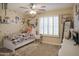 Bright bedroom with a ceiling fan, themed decor and natural light at 2917 E Northridge St, Mesa, AZ 85213
