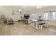Spacious dining room featuring a table with bench seating, stylish furnishings and ample lighting at 2917 E Northridge St, Mesa, AZ 85213