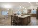 Open-concept kitchen with a large kitchen island and seamless flow into the dining and living areas at 2917 E Northridge St, Mesa, AZ 85213