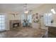 Inviting living room with vaulted ceiling, travertine flooring, and cozy fireplace at 2917 E Northridge St, Mesa, AZ 85213