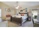 Serene main bedroom with vaulted ceiling, ceiling fan, and exterior access at 2917 E Northridge St, Mesa, AZ 85213