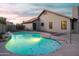 A refreshing in-ground pool with decorative lighting and tile trim at 2917 E Northridge St, Mesa, AZ 85213