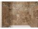 A beautifully tiled shower featuring decorative glass and stone accents at 2917 E Northridge St, Mesa, AZ 85213