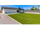 Backyard featuring gravel, a turf area, and a patio at 2926 E Corrine Dr, Phoenix, AZ 85032