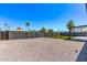 Backyard with gravel, turf, a cinder block fence, and clear blue sky at 2926 E Corrine Dr, Phoenix, AZ 85032