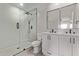 Sleek bathroom with glass-enclosed shower, dual vanity sinks, and modern fixtures at 2926 E Corrine Dr, Phoenix, AZ 85032
