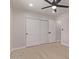 Bedroom showcasing closet doors and a doorway leading to another room at 2926 E Corrine Dr, Phoenix, AZ 85032