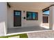 Modern home with a stylish front door, contemporary lighting, and well-maintained landscaping at 2926 E Corrine Dr, Phoenix, AZ 85032
