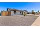 Stylish single-story home with gravel landscaping, modern walkway, and a well-maintained yard at 2926 E Corrine Dr, Phoenix, AZ 85032