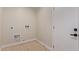 Small laundry room, features connections and space for a washer and dryer at 2926 E Corrine Dr, Phoenix, AZ 85032