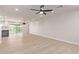 Bright and spacious living area with light wood floors, ceiling fan, and modern finishes at 2926 E Corrine Dr, Phoenix, AZ 85032