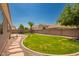Serene backyard featuring a lush lawn, a patio, and mature landscaping at 2945 E Clifton Ave, Gilbert, AZ 85295