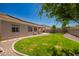 Spacious backyard with patio, solar panels, and lush landscaping at 2945 E Clifton Ave, Gilbert, AZ 85295